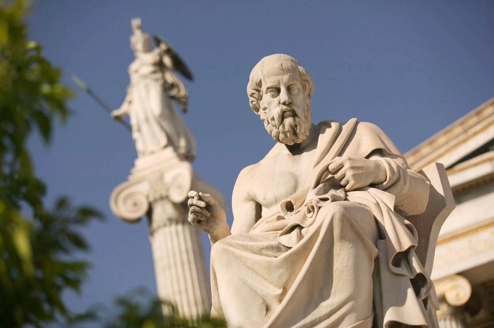 This statue represents Plato sitting in the forecourt to the entrance of the National Academy of Greece. The goddess Athena stands behind and above the philosopher.