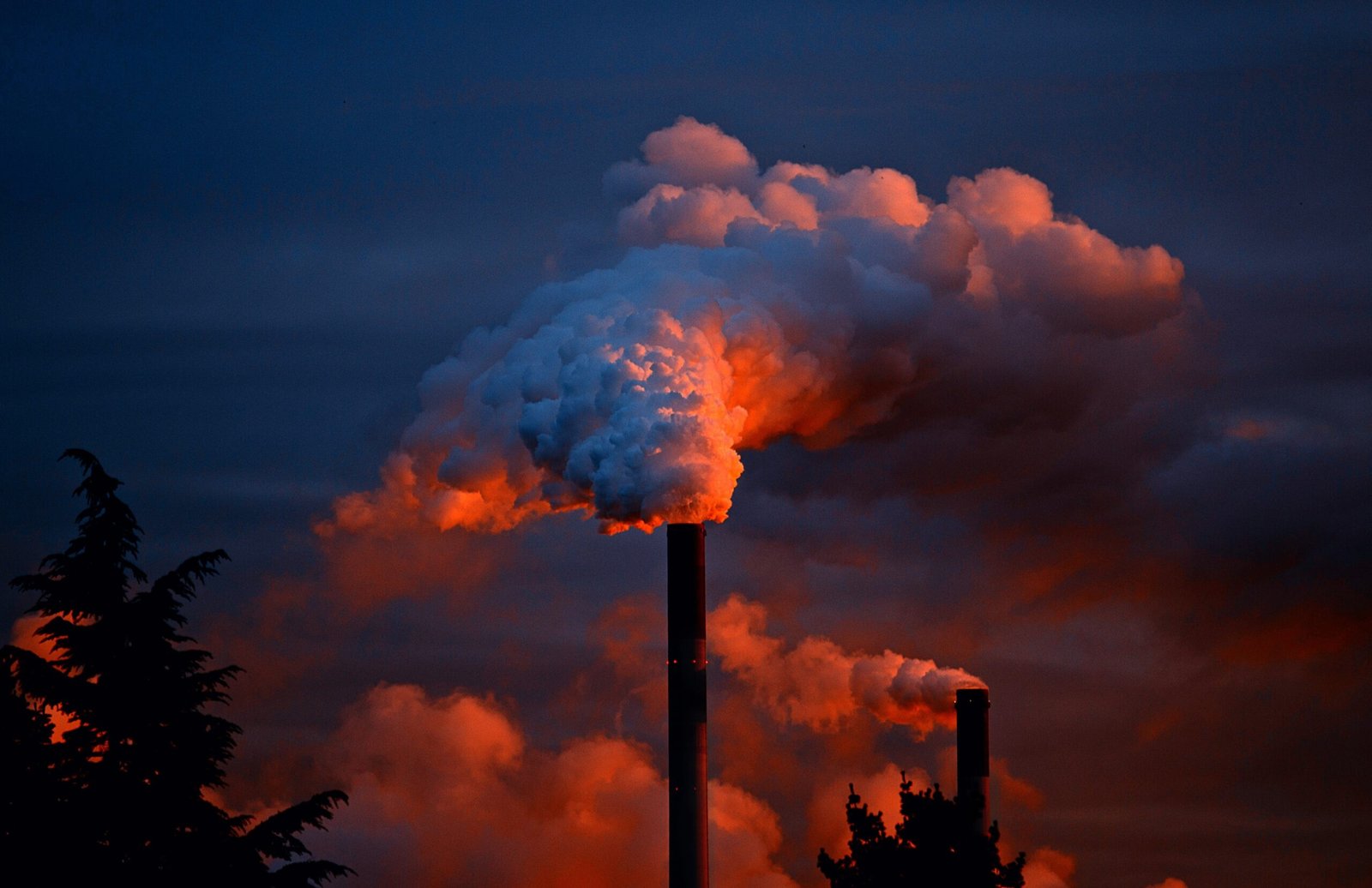 A photograph of air pollution by a factory.